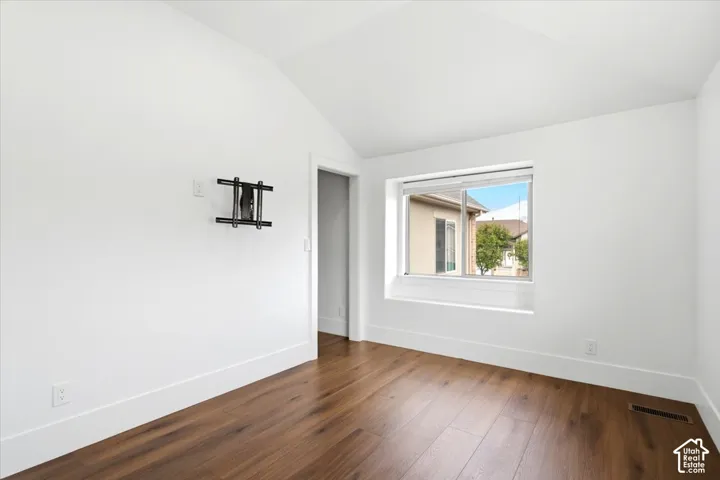 Vaulted ceiling with a flush-mounted light fixture