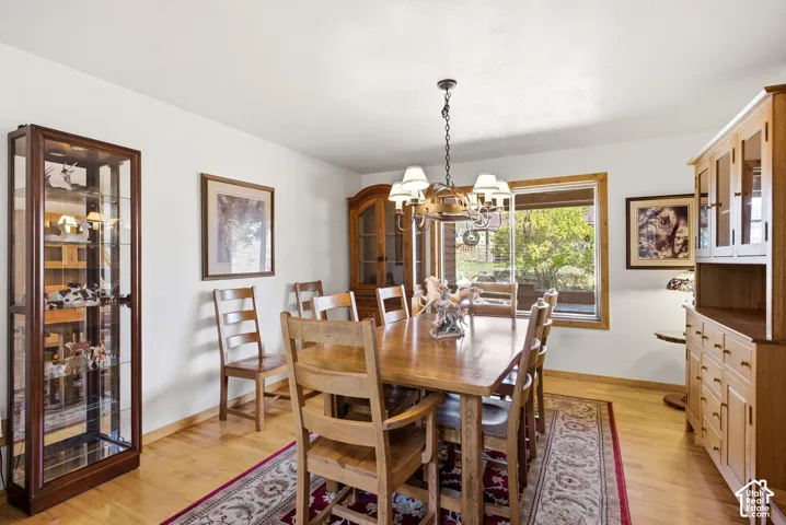 Hardwood flooring, neutral painted walls, built-in cabinetry, and a prominent window