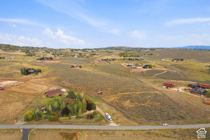Expansive landscape with rolling hills and distant mountains