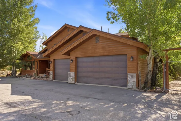 Cedar-clad exterior with stone accents and a multi-gabled roofline