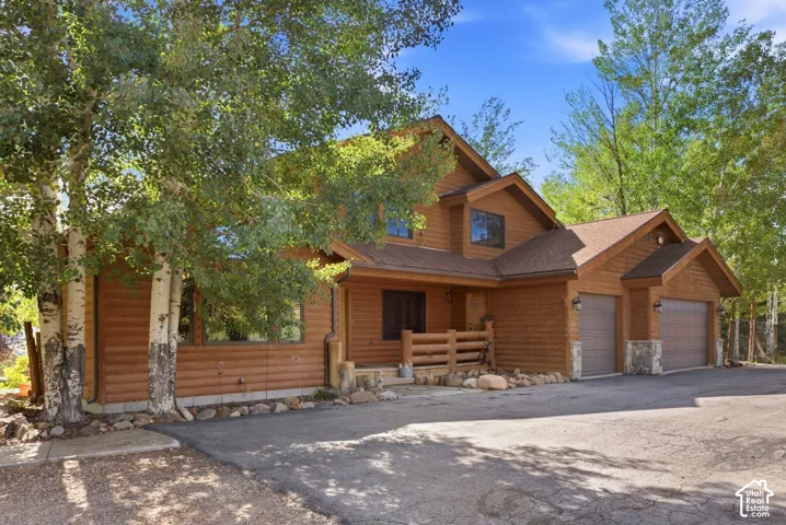 Log-sided exterior with gabled roof lines
