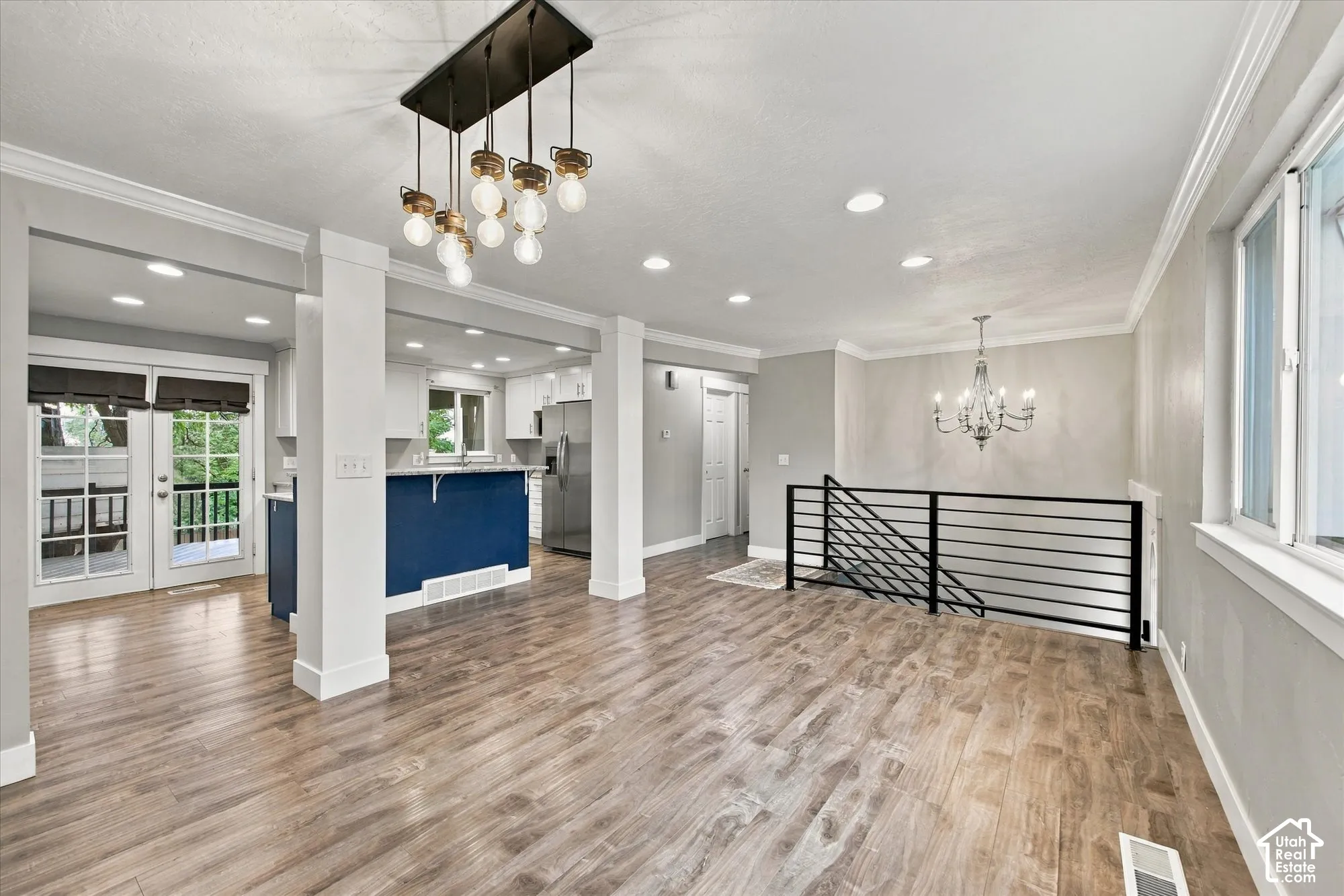 Spacious formal living room with updated lighting - vinyl windows throughout.