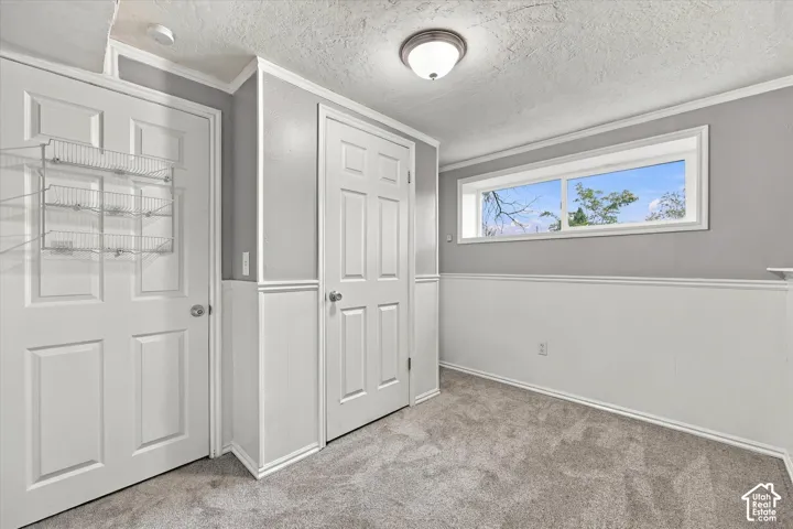 Gray wall paint with white wainscoting, white trim, recessed lighting, and a flush mount light fixture