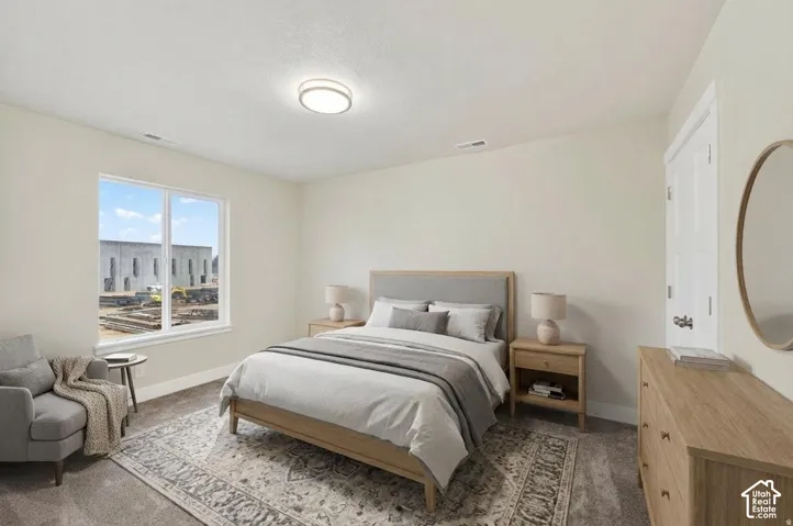 Recessed lighting fixture, white interior door with dark hardware, large window, and light-toned walls