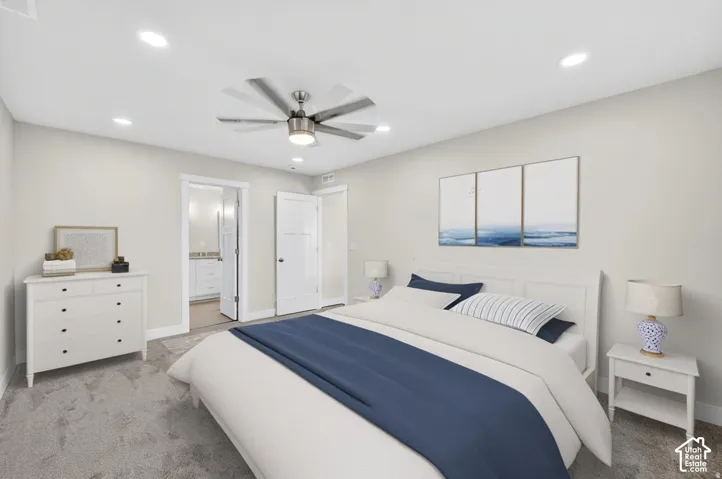 Recessed lighting, ceiling fan with integrated lighting, soft gray wall paint, and gray carpet
