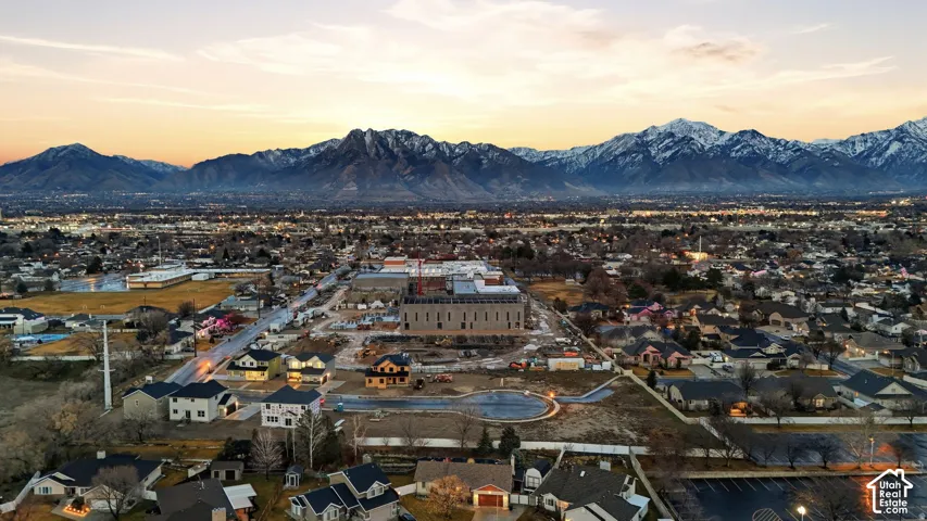 Expansive neighborhood setting with distant snow-capped mountains