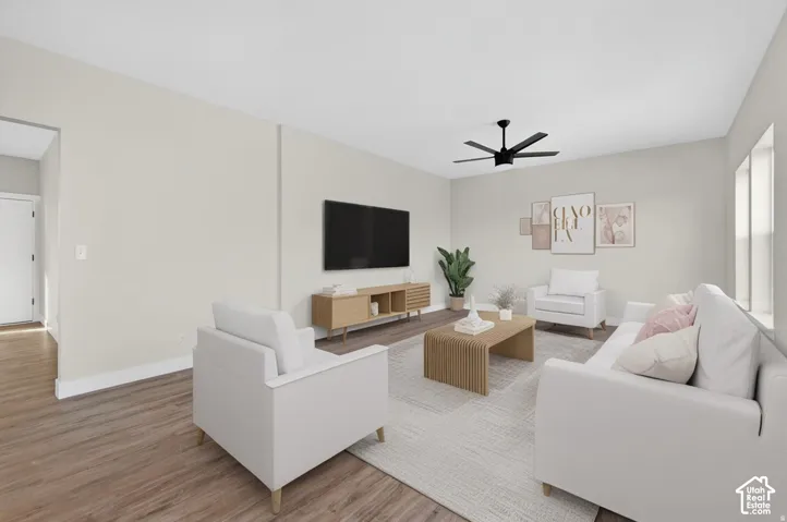 Wood-finish flooring, recessed lighting, and a modern ceiling fan