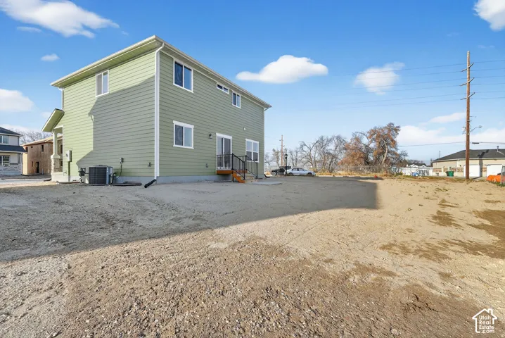 Two-story exterior with light green siding and white trim