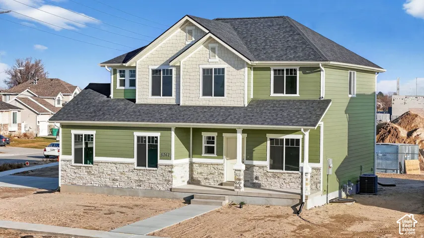 Two-story residence featuring a combination of horizontal siding and shingle siding