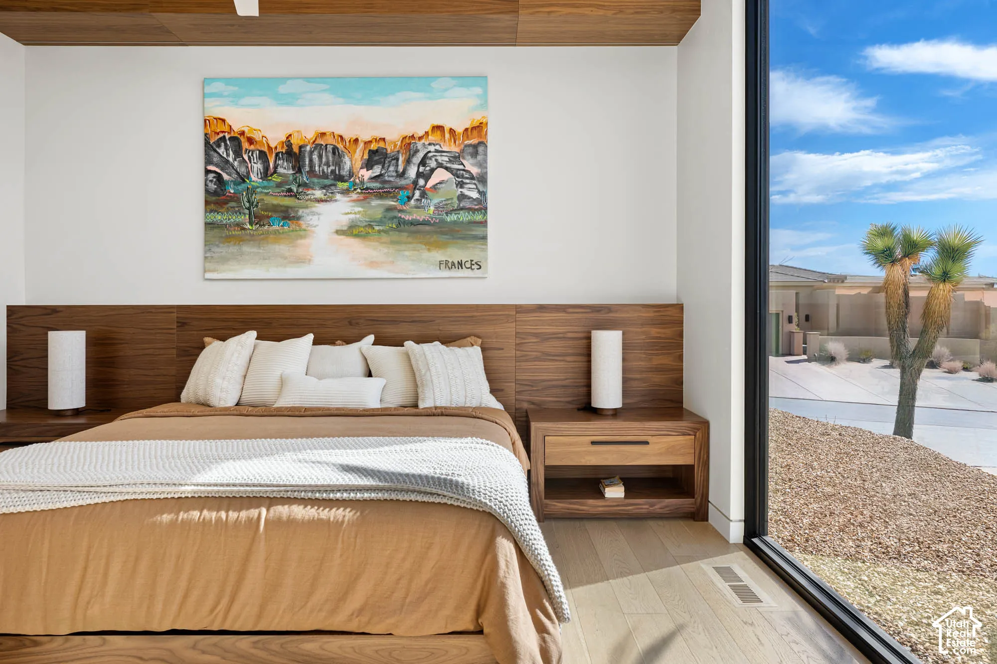 Wood-paneled accent wall with integrated headboard
