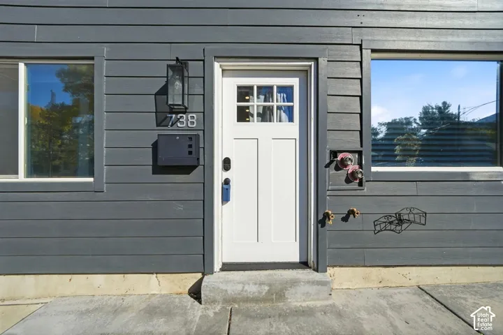 Sleek dark gray siding with contrasting white trim