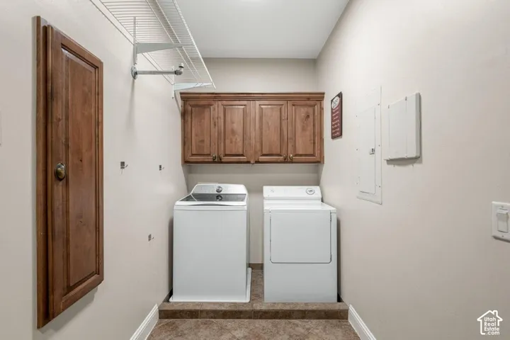 Built-in cabinetry, wire shelving, and wood-finish door