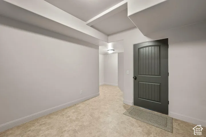 Neutral wall finishes with a decorative panel door