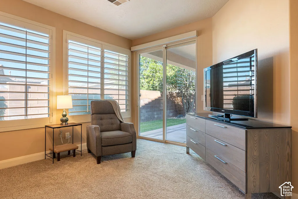Sliding glass door access to a paved patio