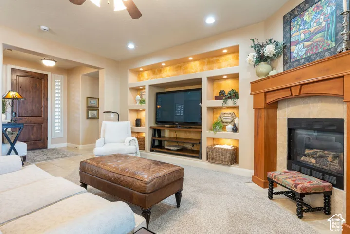 Built-in entertainment center with integrated shelving and accent lighting
