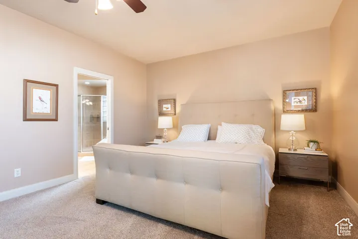 Carpeted flooring throughout, neutral wall tones, and overhead lighting with ceiling fan
