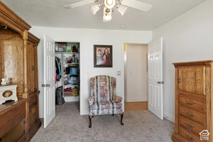 Recessed lighting, ceiling fan, and carpeted flooring