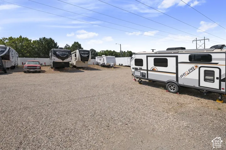 Gravel lot with multiple recreational vehicle parking spaces