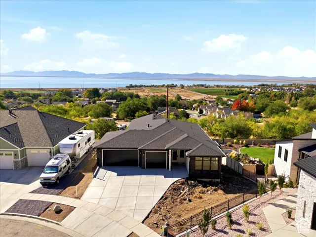 Single-story residence with a dark shingle roof and a two-car garage