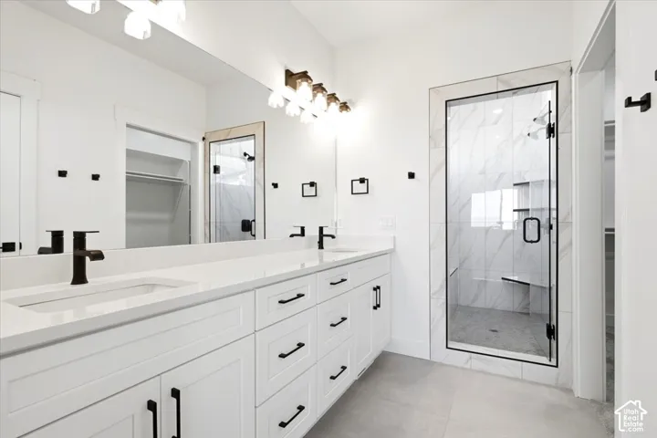 Dual vanity with integrated sinks, quartz countertop, and black fixtures