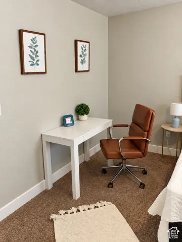 Neutral-toned wall paint and wall-to-wall carpeting