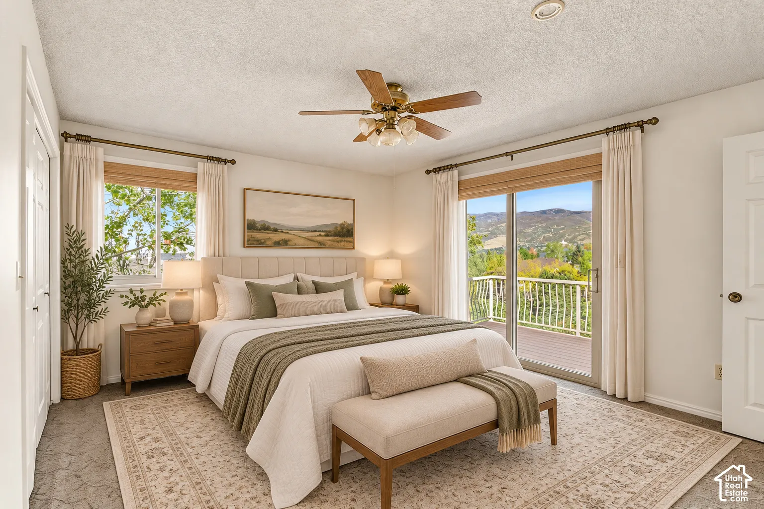 Owner bedroom -Recessed ceiling light, ceiling fan, sliding glass door, private balcony with white railings, and a window with wood-finish blinds