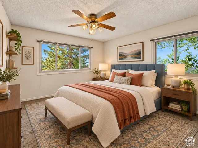 Multiple windows, ceiling fan with integrated lighting, recessed lighting, wood-finish flooring, built-in shelving