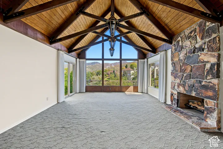 Vaulted wood-paneled ceiling with exposed beams