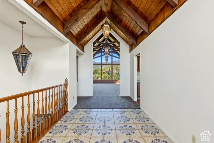 Vaulted wood-finish ceiling with exposed beams