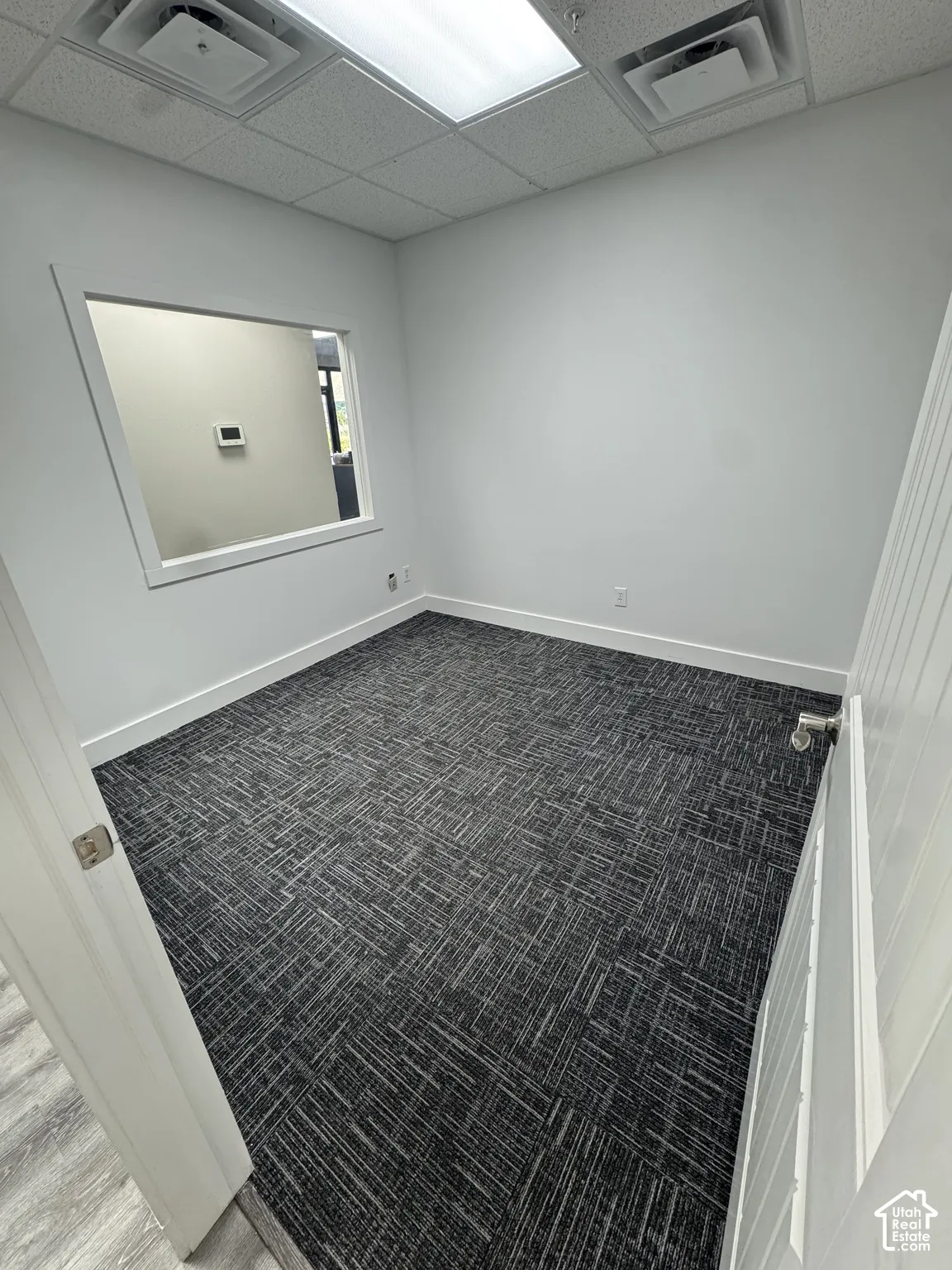 Recessed lighting, drop ceiling, and wall-to-wall carpeting