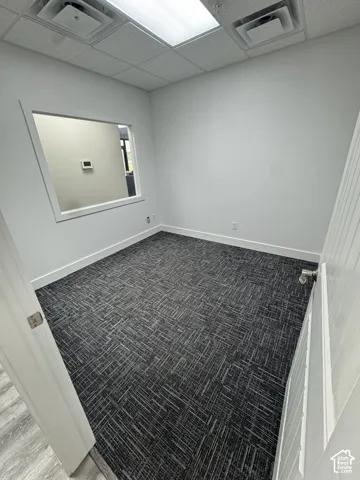 Recessed lighting, drop ceiling, and wall-to-wall carpeting