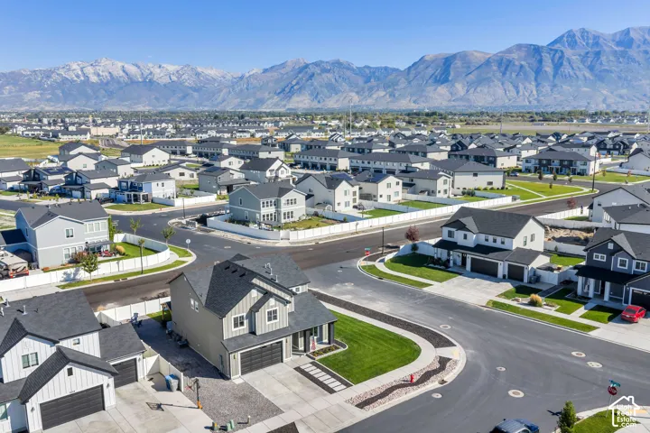 New residential development featuring modern homes with dark roofs and light-colored siding
