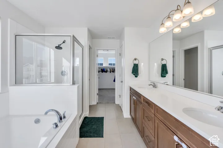 Dual-sink vanity with wood-finish cabinetry and a large mirror