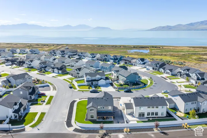 Residential community with consistent architectural styling, cul-de-sac streets, and landscaped front yards
