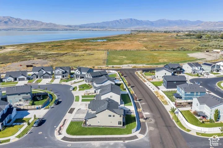 Newly constructed neighborhood with modern homes, paved streets, and manicured lawns