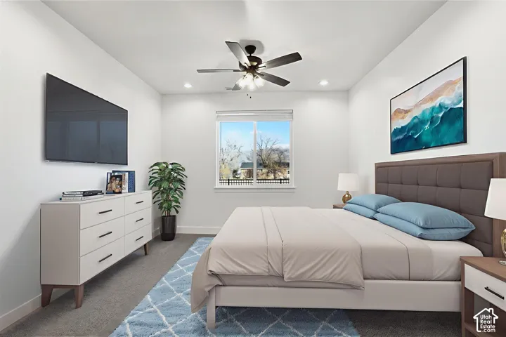 Recessed ceiling lights, ceiling fan, window with blinds, and gray carpet flooring