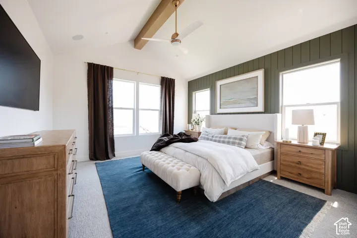 Primary bedroom featuring a wood-frame bed with white bedding, wood-finish nightstands, and recessed ceiling lighting