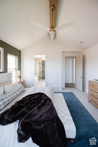 Vaulted ceiling with a contemporary ceiling fan, recessed lighting, and wall paneling