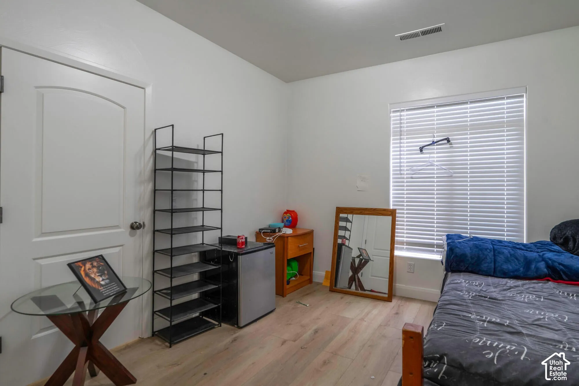 White walls with wood-finish flooring