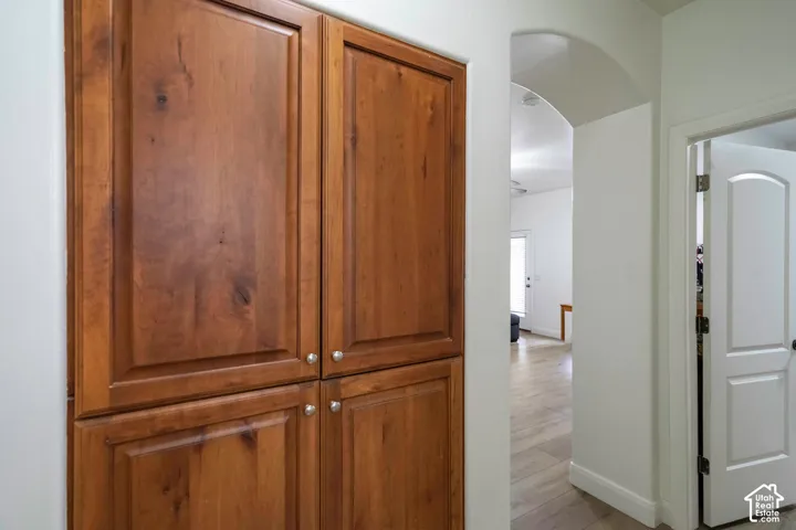 Built-in wood cabinetry with panel doors and silver-toned hardware