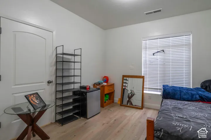 White walls with wood-finish flooring