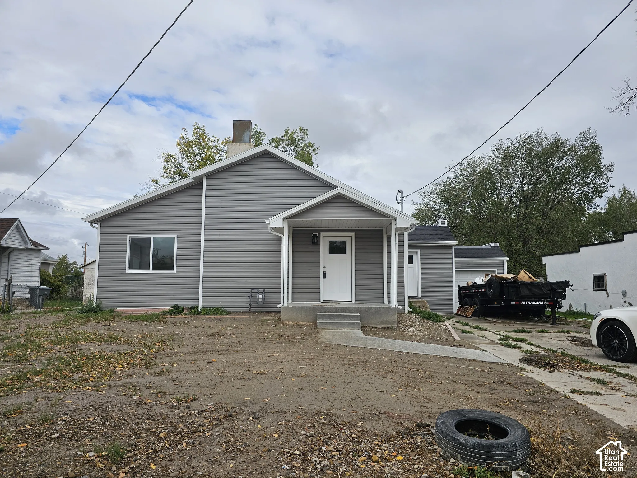 Gray horizontal siding with white trim
