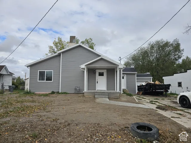 Gray horizontal siding with white trim