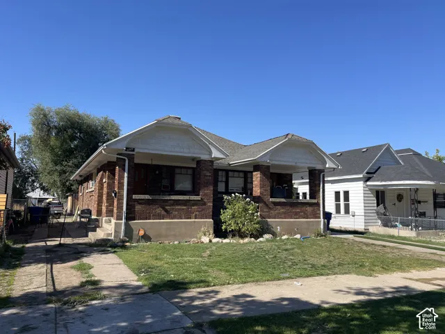 Brick exterior with a covered front porch and gabled roofline