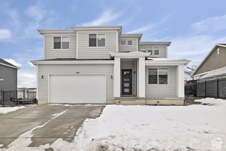 Contemporary exterior with light gray siding and white trim