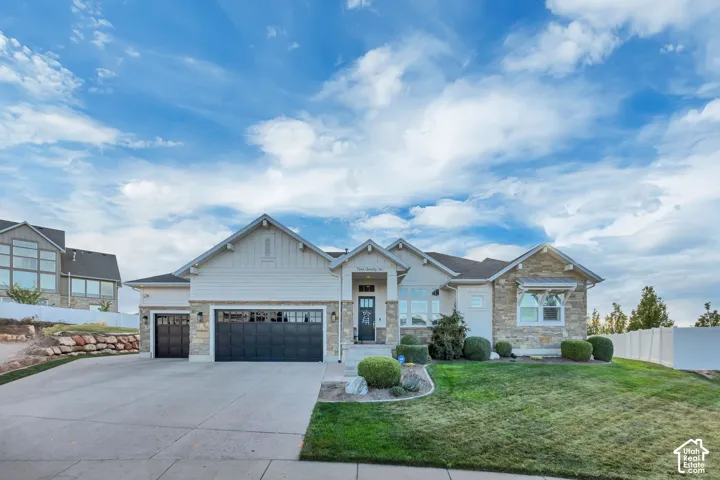 Contemporary ranch-style exterior with stone and siding accents