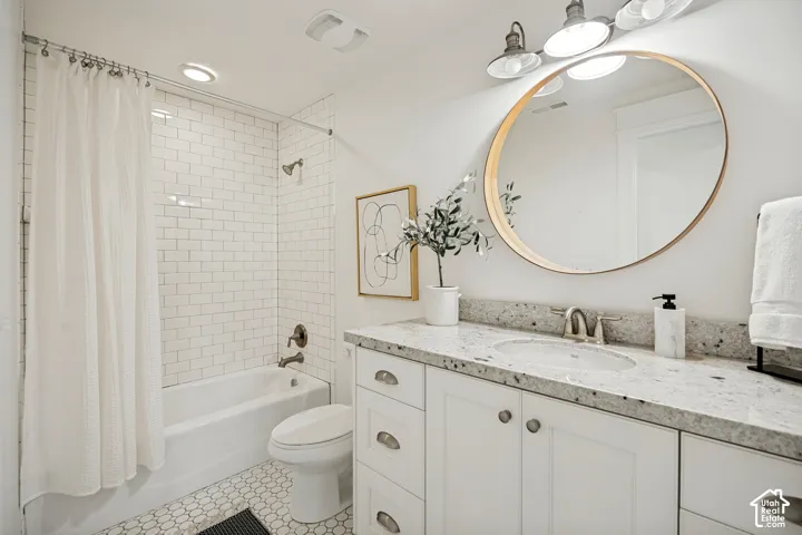 White subway tile shower surround with a built-in tub