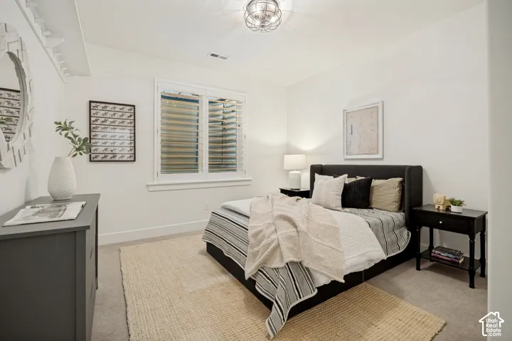 Recessed lighting and a decorative ceiling fixture illuminate the space