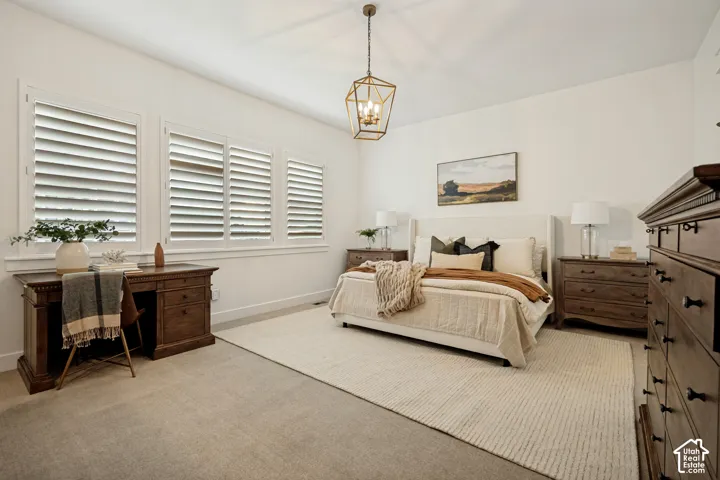 White walls featuring three windows with plantation shutters