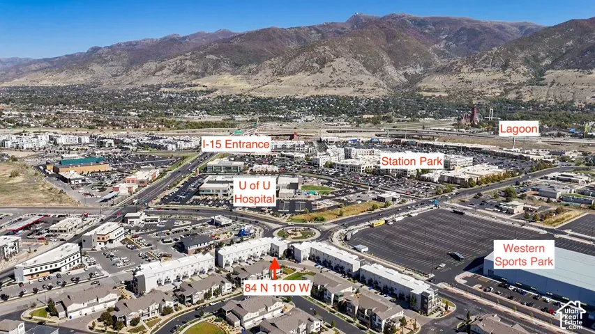 Aerial perspective showcasing urban development with mountain backdrop